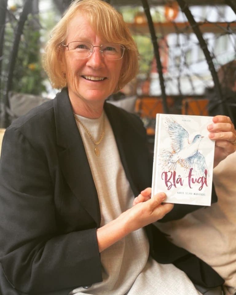 Portrait of Karen Selma Mariendal holding a book